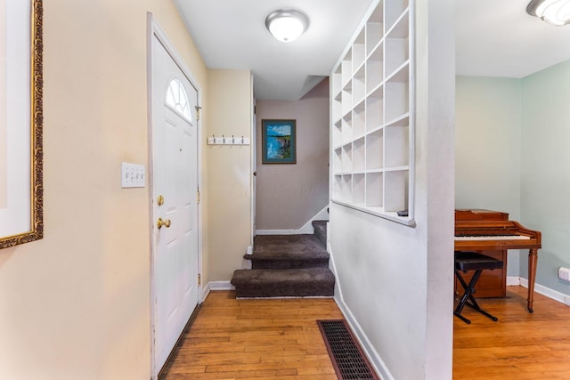 2909 Bryden Rd, Columbus, OH 43209 - hallway featuring light wood-style floors and stairway