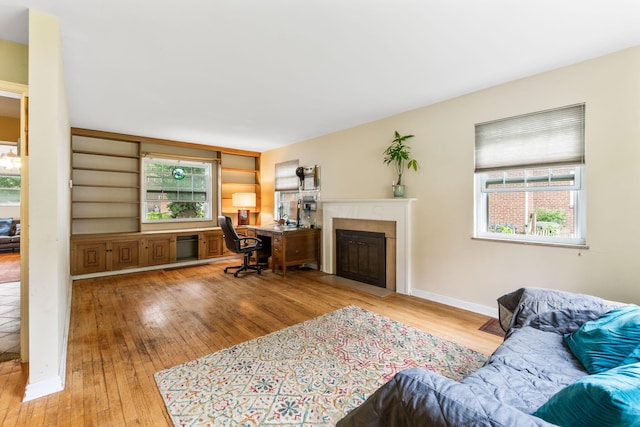 2909 Bryden Rd, Columbus, OH 43209 - living area featuring hardwood / wood-style floors, healthy amount of natural light, and a desk