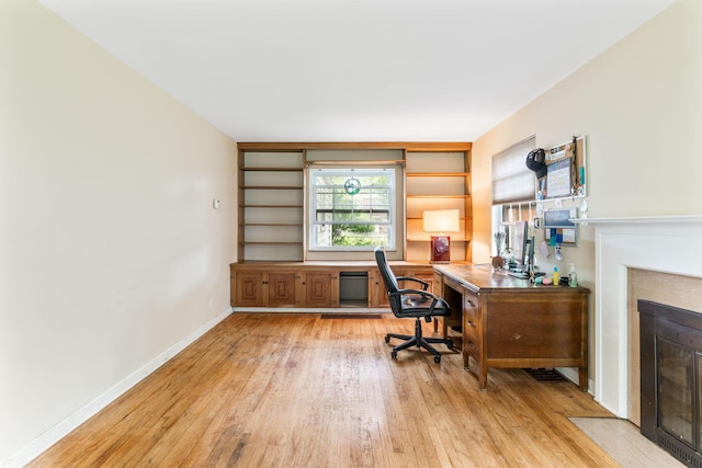 2909 Bryden Rd, Columbus, OH 43209 - office featuring light wood-type flooring and a fireplace with flush hearth