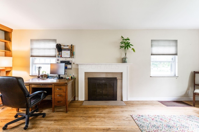 2909 Bryden Rd, Columbus, OH 43209 - home office featuring a fireplace with flush hearth and wood finished floors