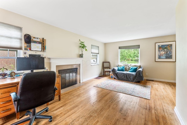 2909 Bryden Rd, Columbus, OH 43209 - home office with hardwood / wood-style floors and a fireplace with flush hearth