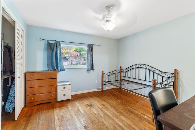 2909 Bryden Rd, Columbus, OH 43209 - bedroom featuring hardwood / wood-style floors, a closet, and ceiling fan