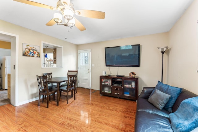 2909 Bryden Rd, Columbus, OH 43209 - living room with a ceiling fan and light wood-style flooring