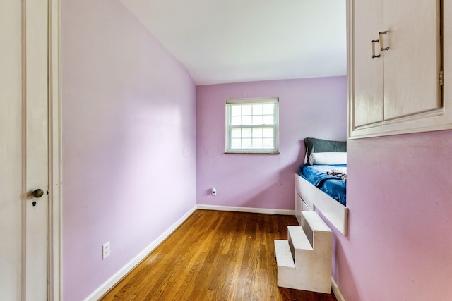 2909 Bryden Rd, Columbus, OH 43209 - unfurnished bedroom featuring wood finished floors and baseboards