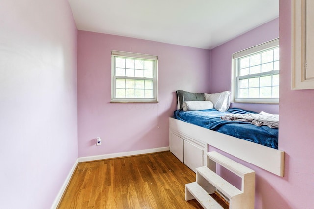 2909 Bryden Rd, Columbus, OH 43209 - bedroom with multiple windows and wood finished floors