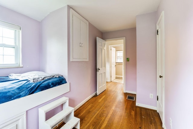 2909 Bryden Rd, Columbus, OH 43209 - bedroom featuring wood finished floors and multiple windows