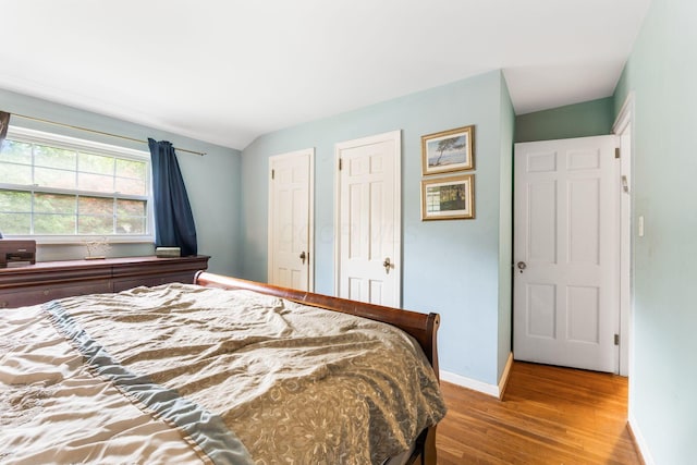 2909 Bryden Rd, Columbus, OH 43209 - bedroom featuring wood finished floors and baseboards