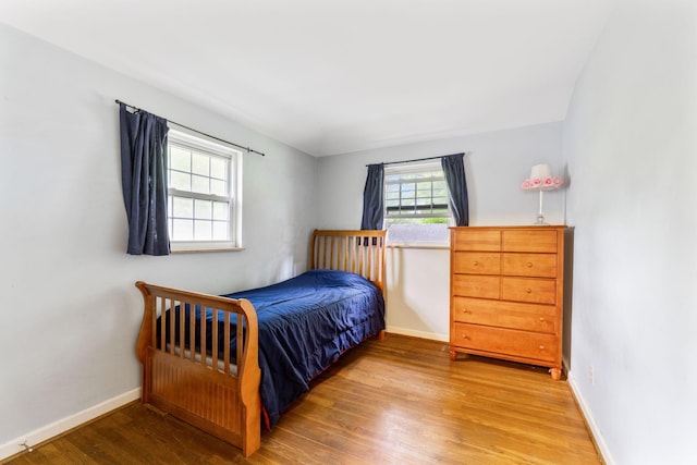 2909 Bryden Rd, Columbus, OH 43209 - bedroom featuring wood finished floors and baseboards
