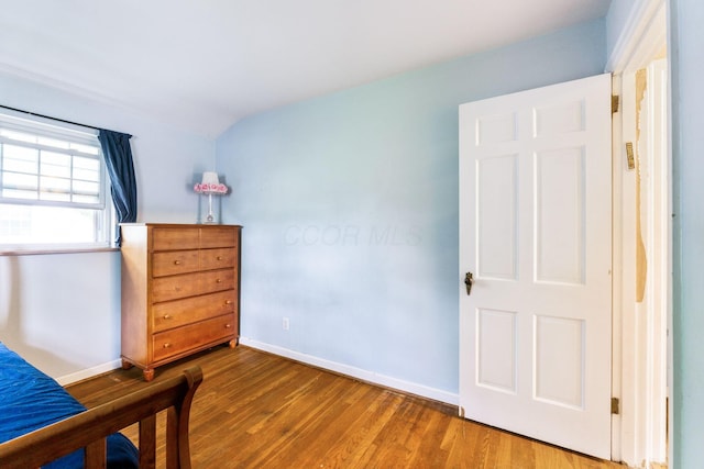 2909 Bryden Rd, Columbus, OH 43209 - bedroom with vaulted ceiling and wood finished floors