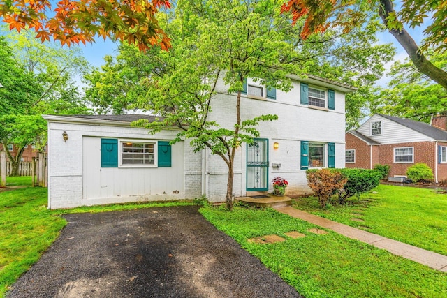 2909 Bryden Rd, Columbus, OH 43209 - view of front facade with brick siding and a front lawn