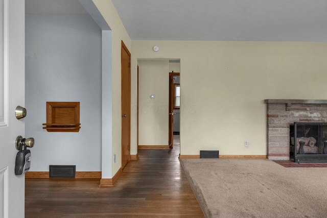 824 Colonial Dr, Heath, OH 43056 - unfurnished living room with wood finished floors and a fireplace