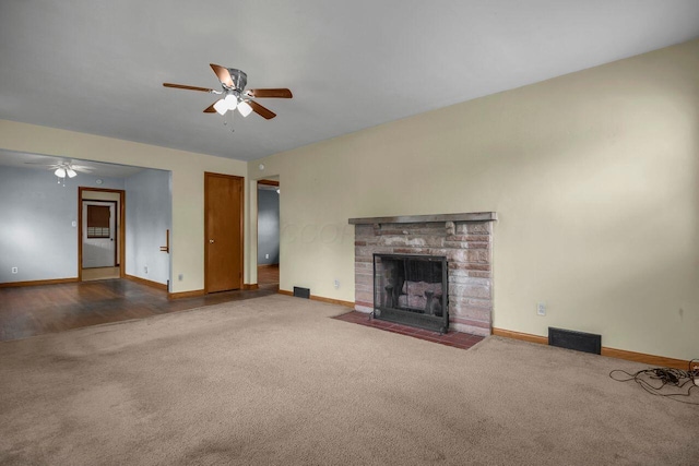 824 Colonial Dr, Heath, OH 43056 - unfurnished living room with ceiling fan, carpet floors, and a brick fireplace
