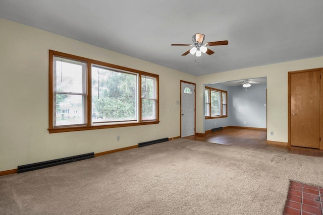 824 Colonial Dr, Heath, OH 43056 - carpeted empty room featuring ceiling fan and a baseboard heating unit