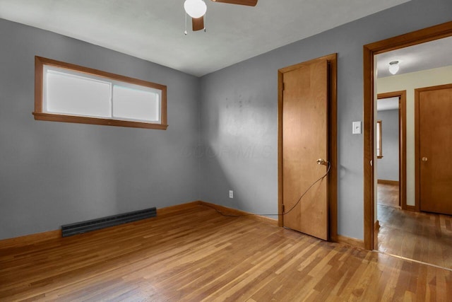 824 Colonial Dr, Heath, OH 43056 - unfurnished bedroom featuring light wood-style flooring and a ceiling fan