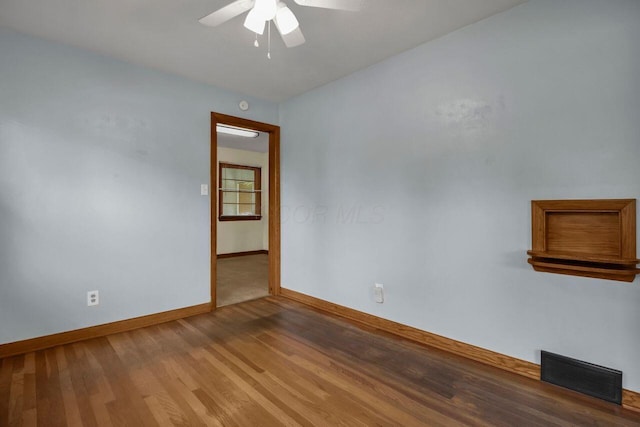 824 Colonial Dr, Heath, OH 43056 - unfurnished room featuring a ceiling fan and wood finished floors