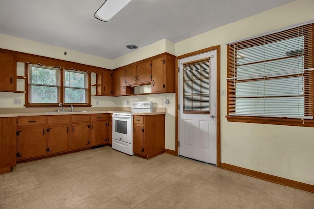 824 Colonial Dr, Heath, OH 43056 - kitchen featuring electric stove, light countertops, brown cabinetry, and open shelves
