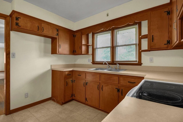 824 Colonial Dr, Heath, OH 43056 - kitchen with open shelves, light countertops, and brown cabinets