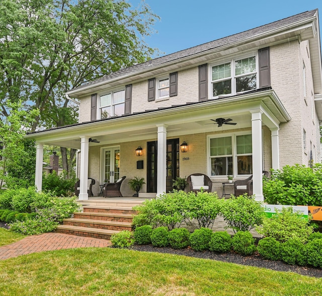 1968 Coventry Rd, Upper Arlington, OH 43212 - view of front of house featuring a ceiling fan, brick siding, covered porch, and french doors