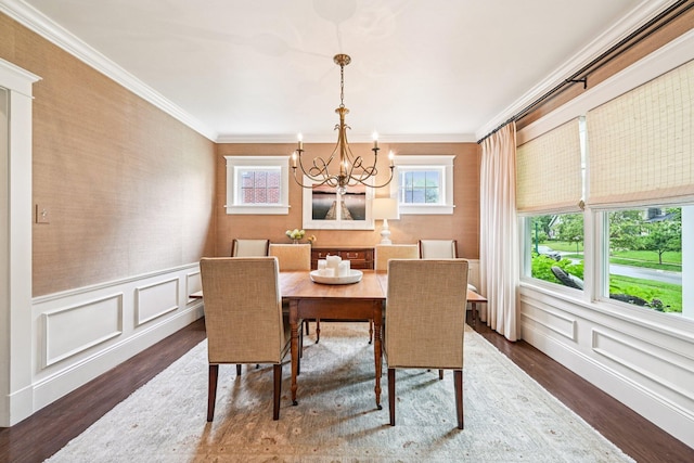 1968 Coventry Rd, Upper Arlington, OH 43212 - dining room with a chandelier, ornamental molding, wood finished floors, a decorative wall, and wainscoting