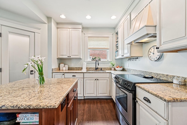 1968 Coventry Rd, Upper Arlington, OH 43212 - kitchen with stainless steel electric range, custom range hood, light stone counters, dark wood-style flooring, and recessed lighting