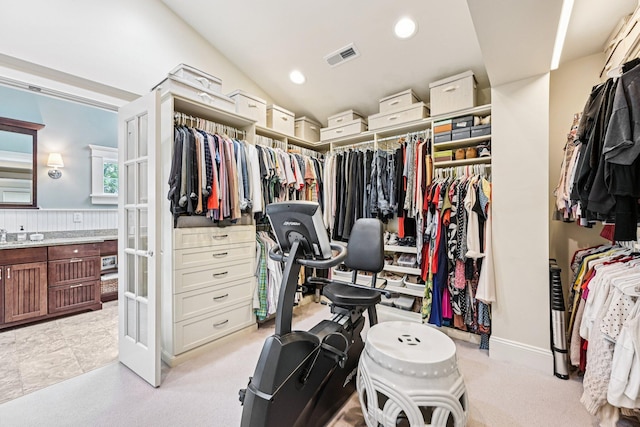 1968 Coventry Rd, Upper Arlington, OH 43212 - spacious closet featuring french doors, light colored carpet, and vaulted ceiling