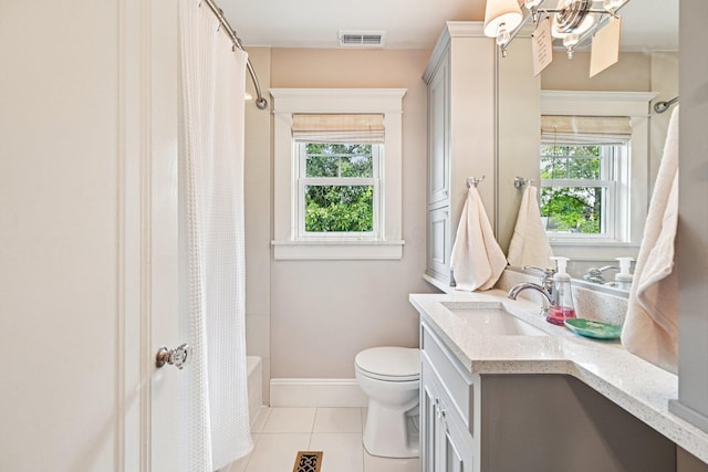 1968 Coventry Rd, Upper Arlington, OH 43212 - full bathroom featuring plenty of natural light, tile patterned flooring, vanity, and shower / bath combo