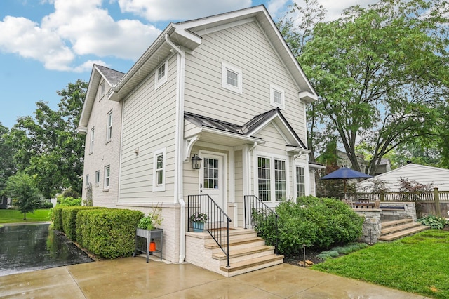 1968 Coventry Rd, Upper Arlington, OH 43212 - view of front facade featuring a standing seam roof and a metal roof
