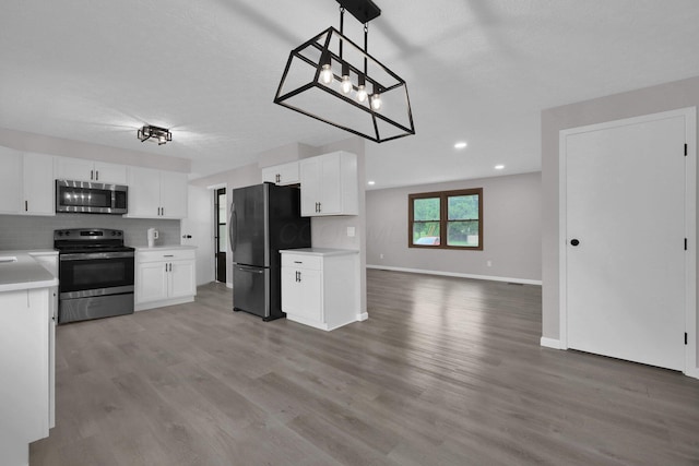251 Florence Dr, Pickerington, OH 43147 - kitchen with stainless steel appliances, open floor plan, light countertops, light wood finished floors, and recessed lighting