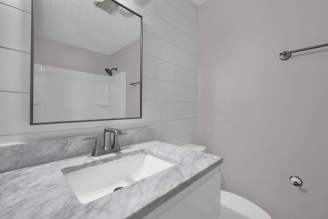251 Florence Dr, Pickerington, OH 43147 - bathroom with vanity, a shower, and a textured ceiling