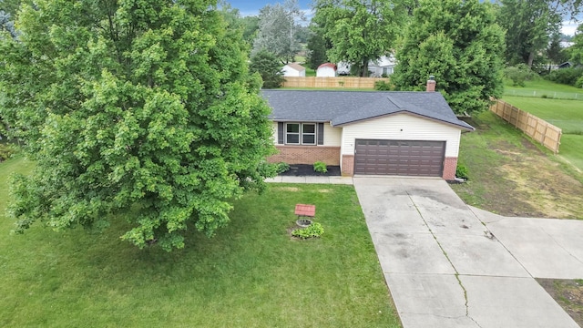 251 Florence Dr, Pickerington, OH 43147 - view of front facade with brick siding, an attached garage, driveway, and roof with shingles