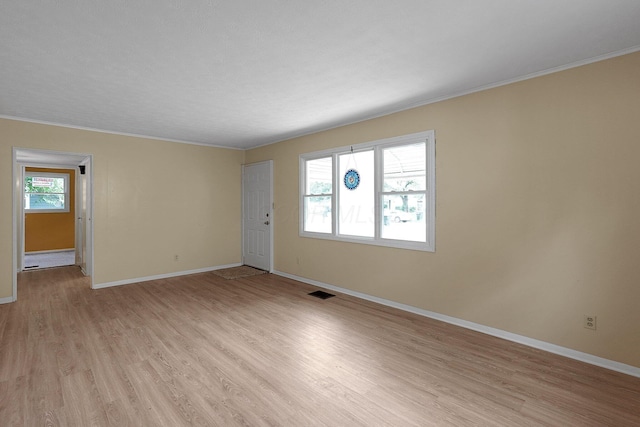 1086 S Hampton Rd, Columbus, OH 43227 - empty room featuring light wood-style flooring and ornamental molding