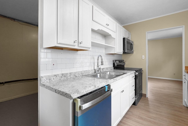 1086 S Hampton Rd, Columbus, OH 43227 - kitchen featuring dishwashing machine, black range with electric cooktop, stainless steel microwave, decorative backsplash, and light countertops