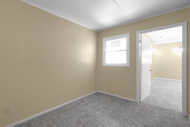 1086 S Hampton Rd, Columbus, OH 43227 - carpeted empty room featuring crown molding and baseboards