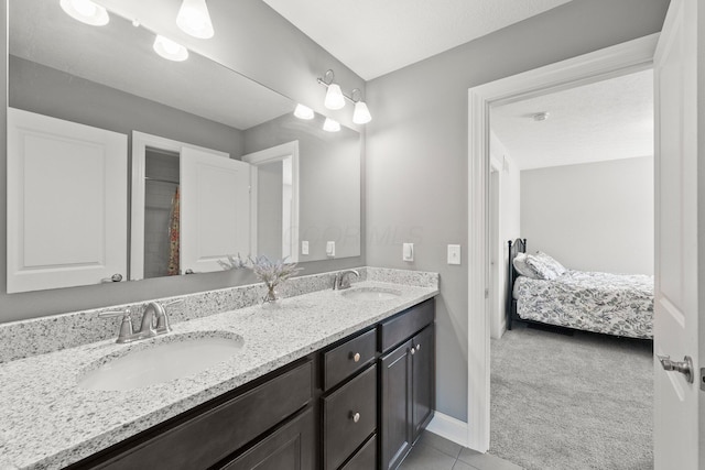 10640 Honeysuckle Way, Plain City, OH 43064 - bathroom with double vanity, connected bathroom, and tile patterned floors