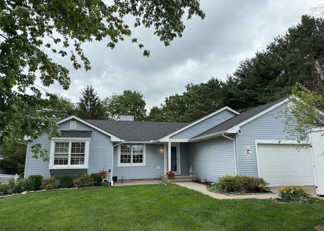 1885 Itawamba Trl, London, OH 43140 - ranch-style house featuring an attached garage, roof with shingles, a front yard, and a chimney