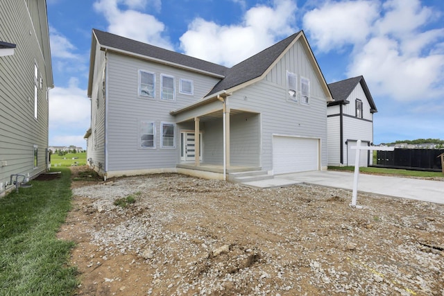 3699 Kassidy Dr, Grove City, OH 43123 - view of front of house with board and batten siding, driveway, and a garage