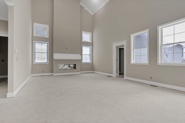 3699 Kassidy Dr, Grove City, OH 43123 - unfurnished living room with high vaulted ceiling and light carpet