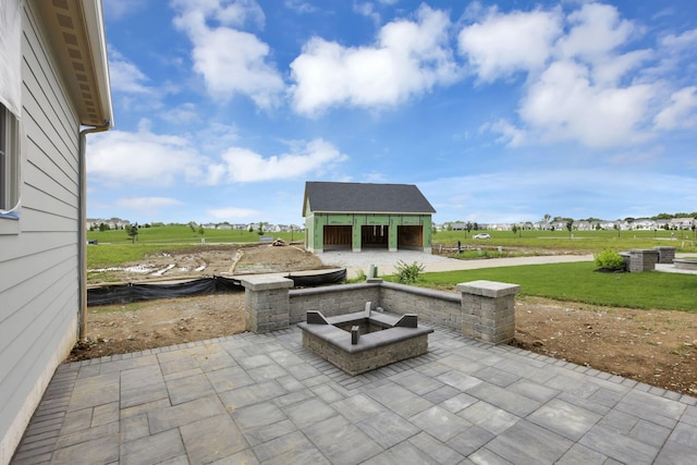 3699 Kassidy Dr, Grove City, OH 43123 - view of patio / terrace featuring an outdoor fire pit, an outbuilding, and a rural view