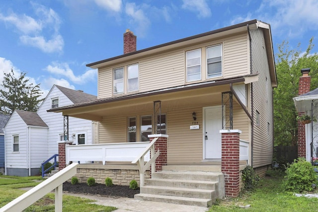 794 E Deshler Ave, Columbus, OH 43206 - view of front of property with covered porch and a chimney