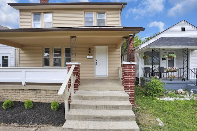 794 E Deshler Ave, Columbus, OH 43206 - view of front of property with a porch and a chimney