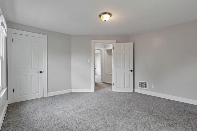 794 E Deshler Ave, Columbus, OH 43206 - unfurnished bedroom featuring carpet and baseboards