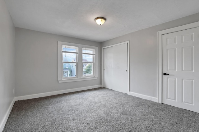 794 E Deshler Ave, Columbus, OH 43206 - unfurnished bedroom featuring carpet floors and a closet
