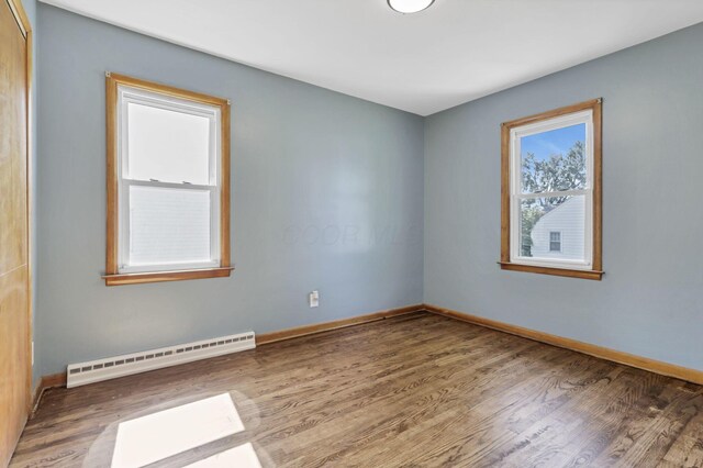 678 E Fair Ave, Lancaster, OH 43130 - empty room with baseboard heating and wood finished floors