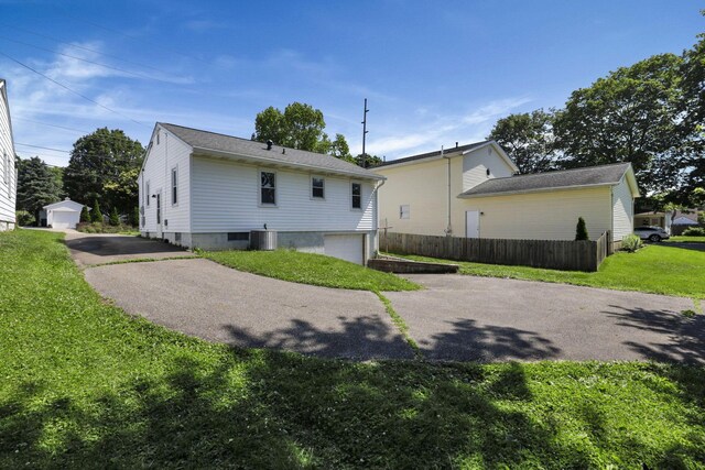 678 E Fair Ave, Lancaster, OH 43130 - rear view of property with asphalt driveway and an attached garage