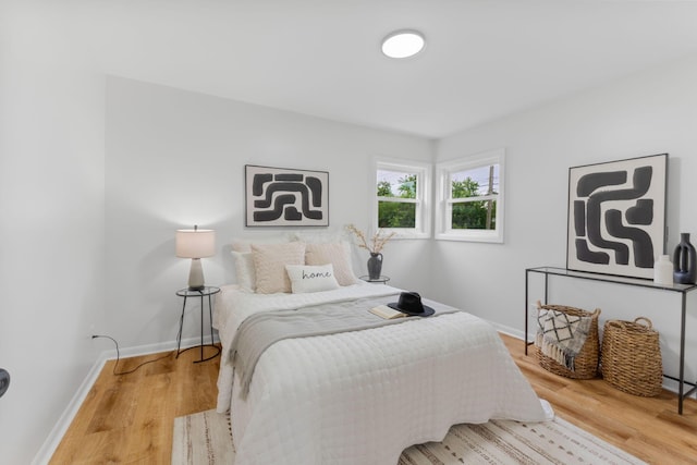 2203 Belcher Dr, Columbus, OH 43224 - bedroom featuring baseboards and wood finished floors