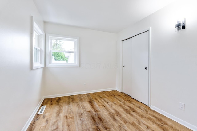 2203 Belcher Dr, Columbus, OH 43224 - unfurnished bedroom with light wood finished floors and a closet