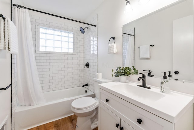 2203 Belcher Dr, Columbus, OH 43224 - full bath featuring vanity, shower / bath combo, and wood finished floors