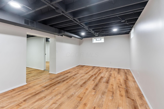 2203 Belcher Dr, Columbus, OH 43224 - basement with wood finished floors and baseboards