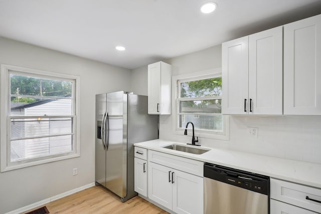 1358 Moler Rd, Columbus, OH 43207 - kitchen with appliances with stainless steel finishes, healthy amount of natural light, backsplash, and recessed lighting