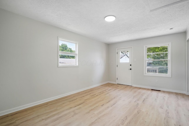 1358 Moler Rd, Columbus, OH 43207 - entrance foyer featuring light wood-type flooring and a textured ceiling